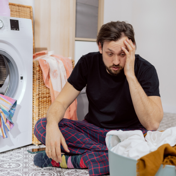 Man Overwhelmed By Laundry 600X600