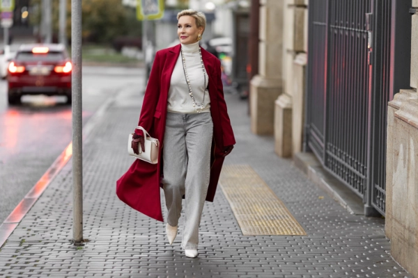 Stylish Woman In White Outfit And Red Coat 600X400